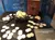 The image shows a display case with concreted silver US half dollars from 1850-1860, a book titled 'SS Republic' and some individual coins and coin clusters, suggesting a historical or marine treasure exhibition.