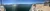 The image shows a panoramic view of a lake from a boat deck with empty chairs and a few people enjoying the sunny weather.