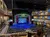 The image shows an empty theater with elaborate decorations and a stage set up for a show titled