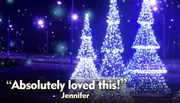 A child in a Santa hat looks longingly out of a window at night towards a brightly lit Ferris wheel, with the caption