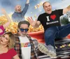 The image features a group of people joyfully posing in front of an exploding popcorn scene with a Laughter in Overdrive sign and a Missouri Route 76 sign in the background