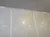 A wall displays a list of names under the heading