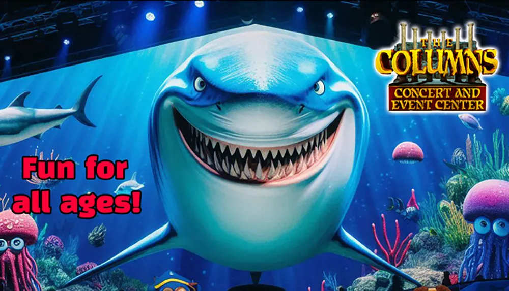 The image shows a vibrant underwater scene with a smiling cartoon shark colorful sea creatures and the text Fun for all ages along with The Columns Concert and Event Center logo