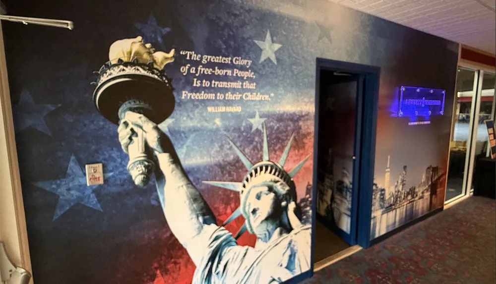 The image features a mural with the Statue of Liberty and a quote by William Havard against a backdrop of stars and a cityscape